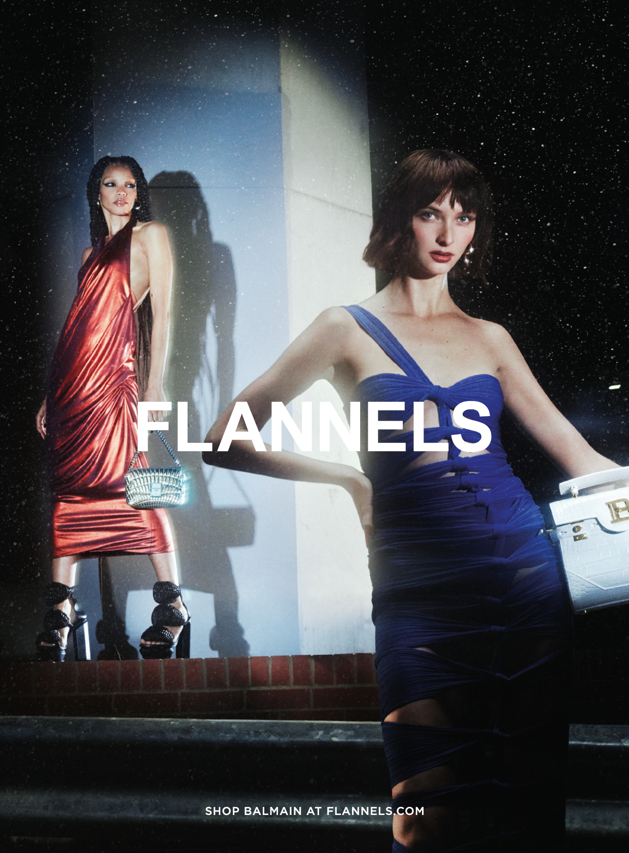 Two models – one in a red evening dress the other in a purple evening dress with Flannels logo across the middle of the page.
