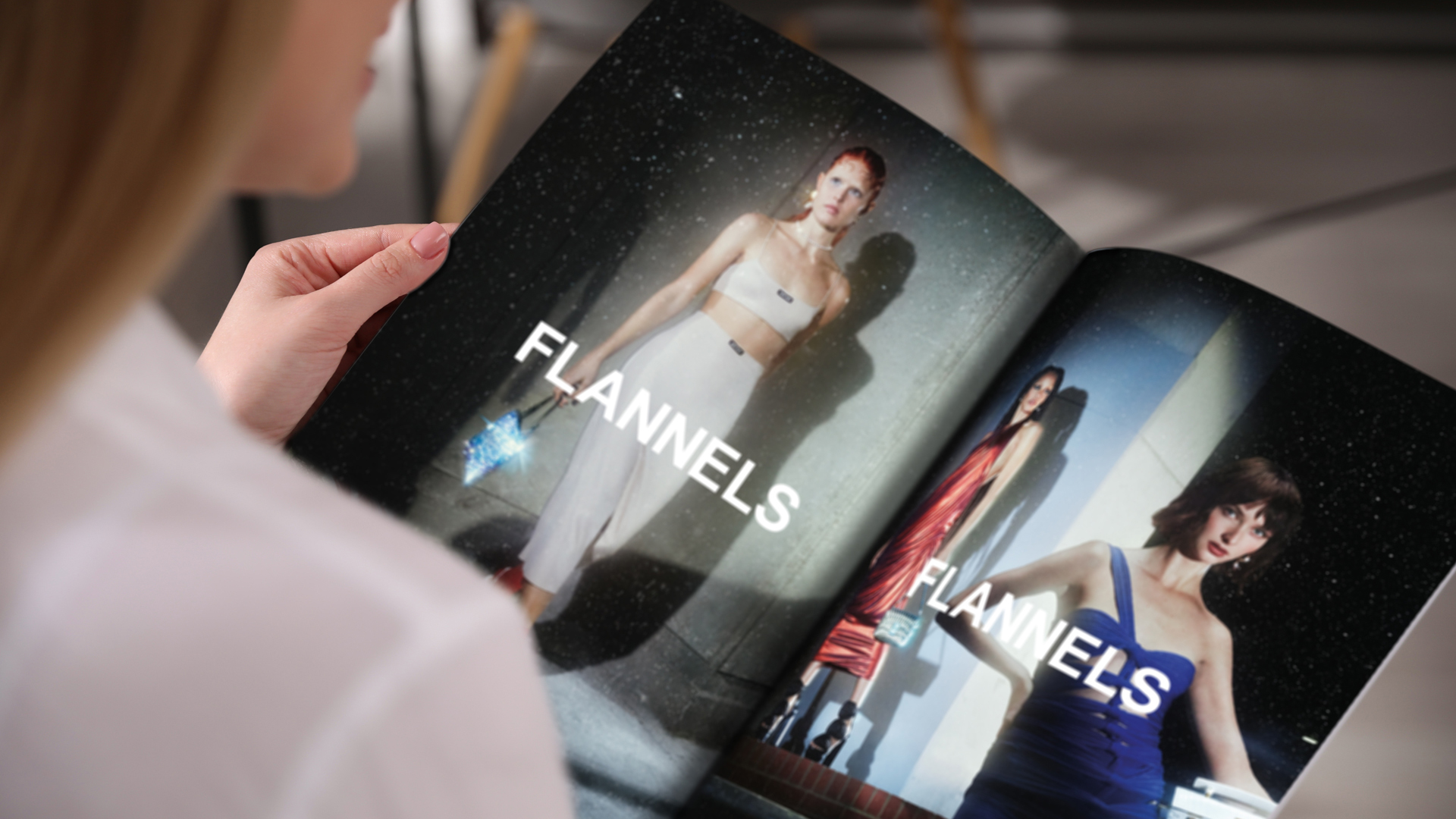 A woman reading a magazine showing two flannels advertisements